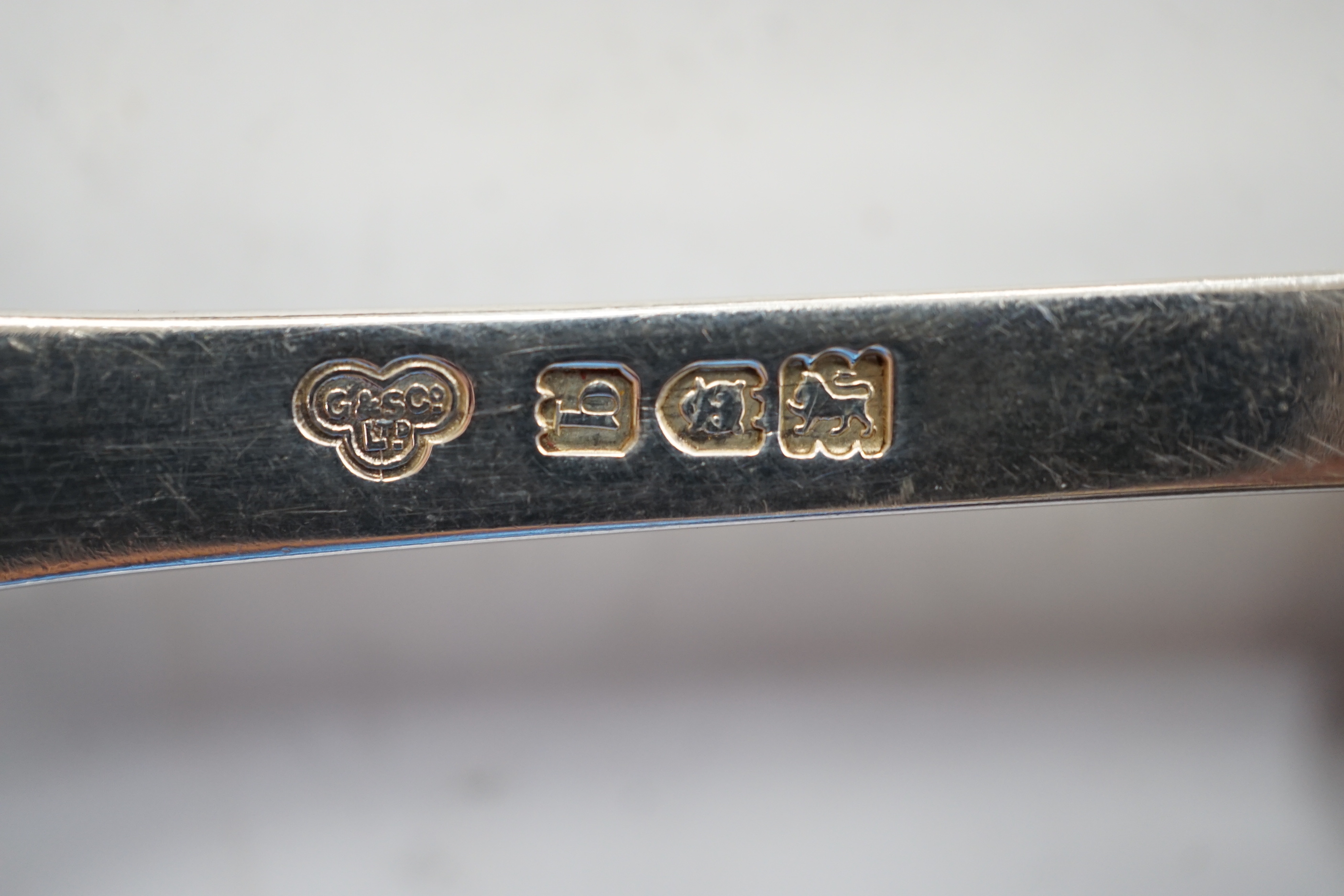 A pair of George V silver rat tail trefid spoons, Goldsmiths & Silversmiths Co Ltd, London, 1911, 20.2cm, three cased sets of silver coffee spoons and other silver flatware